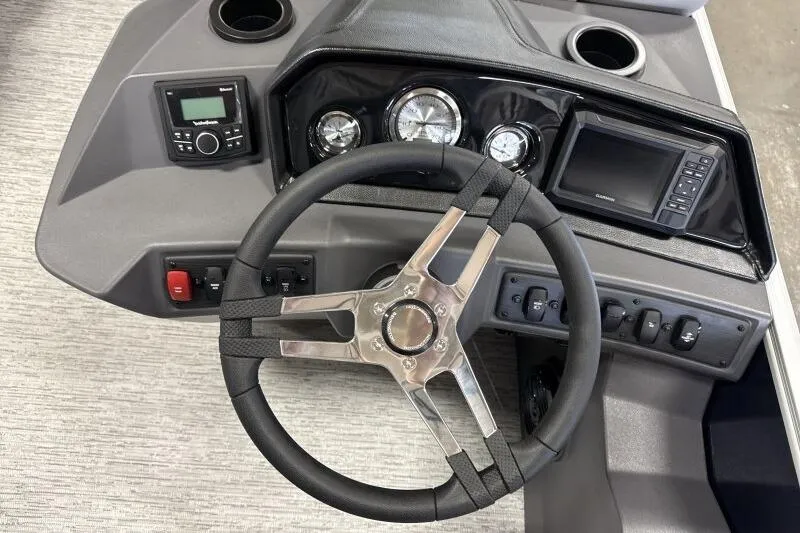 Slide: The Image of 2026 Bennington 23 SSBSF boat dashboard with steering wheel, gauges, and controls. - 19