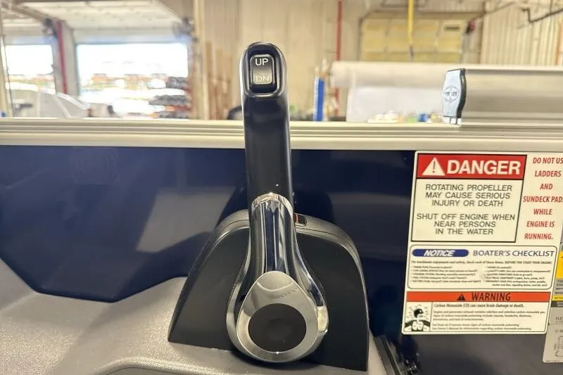 Slide: The Image of Throttle control and safety warnings on a 2026 Bennington 23 SSBSF boat. - 20