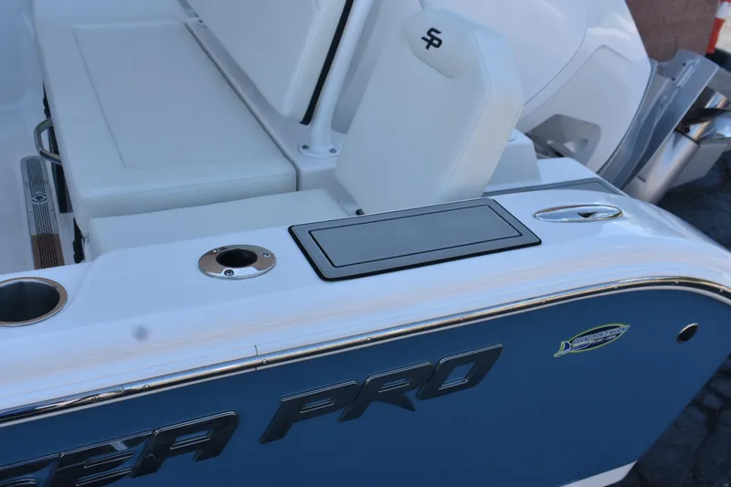 Slide: The Image of 2025 Sea Pro 245 Sandbar boat interior with seating and storage features. - 16