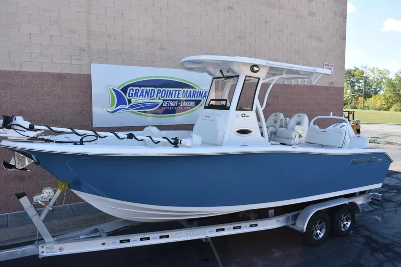 Slide: The Image of 2025 Sea Pro 245 Sandbar boat on trailer at Grand Pointe Marina. - 2