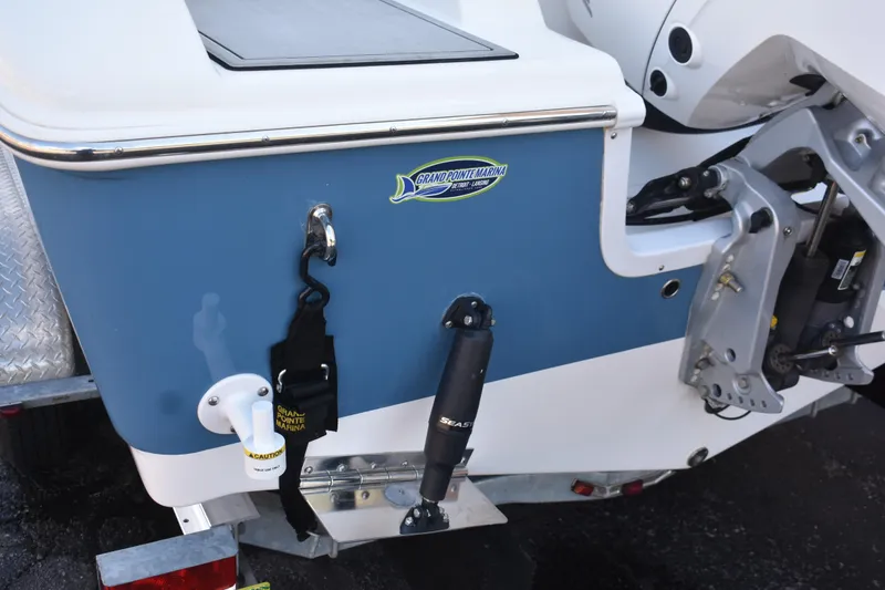 Slide: The Image of 2025 Sea Pro 245 Sandbar boat stern with motor mount and marina sticker. - 24
