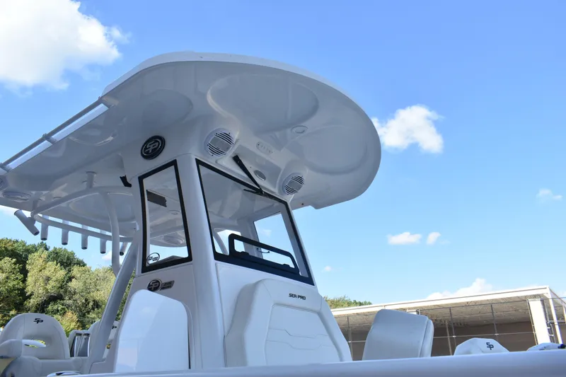 Slide: The Image of 2025 Sea Pro 245 Sandbar boat with sleek design under clear blue sky. - 28