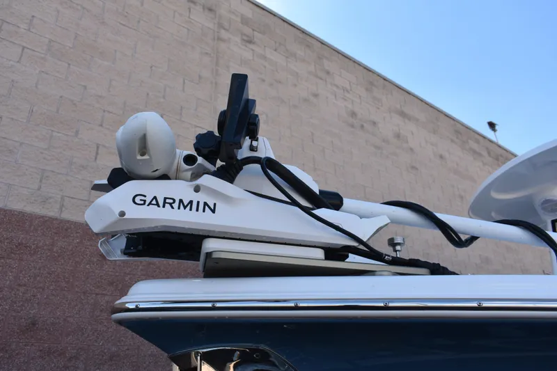 Slide: The Image of Garmin equipment on 2025 Sea Pro 245 Sandbar boat, mounted against a brick wall. - 4