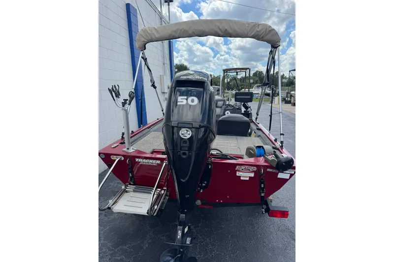 Slide: The Image of 2022 Tracker Pro 170 boat with Mercury 50 engine, parked outdoors. - 4