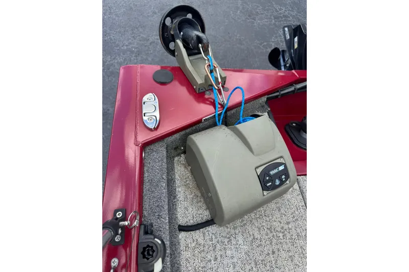Slide: The Image of 2022 Tracker Pro 170 boat with trolling motor and control panel on red deck. - 5
