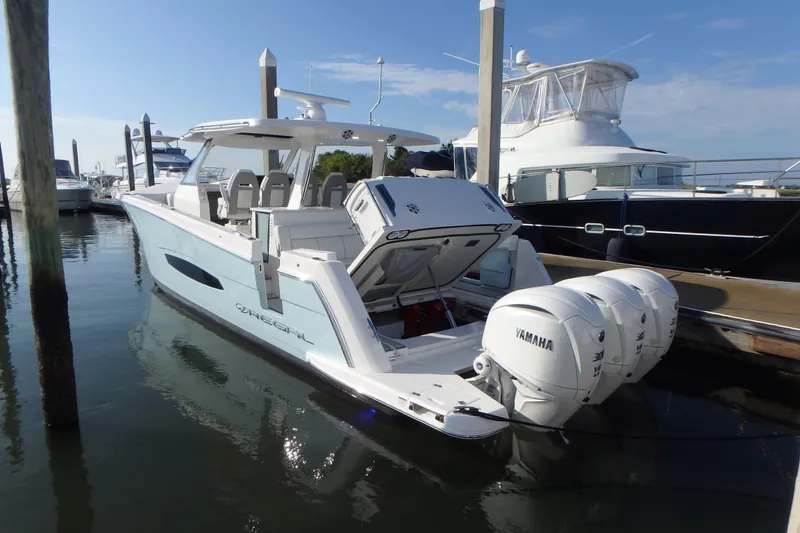 The Image of 2022 Regal 38 SAV boat on display outdoors. - 0