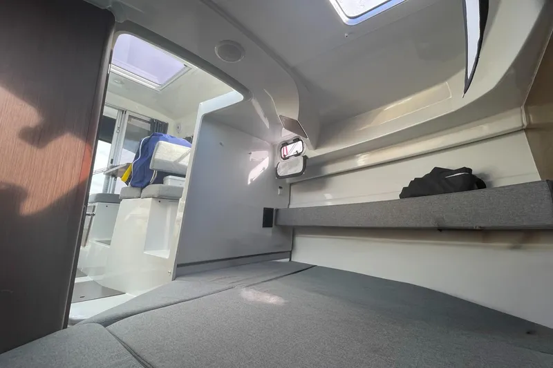Slide: The Image of Interior of 2020 Beneteau Antares 23 boat, featuring seating and modern design. - 16