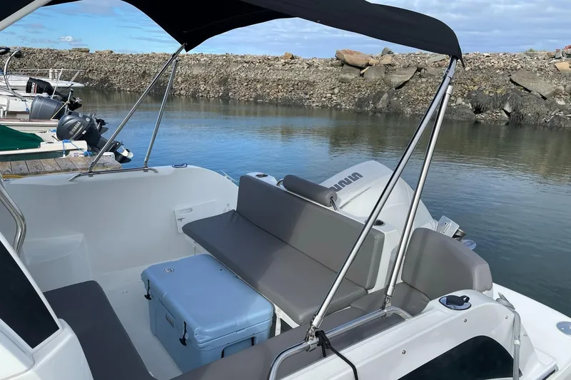 Slide: The Image of 2020 Beneteau Antares 23 boat with seating and Yamaha outboard motor. - 21