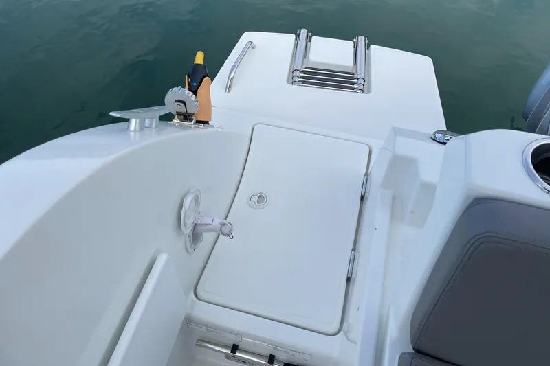 Slide: The Image of Beneteau Antares 23, 2020 model, boat deck with ladder and storage compartment. - 25