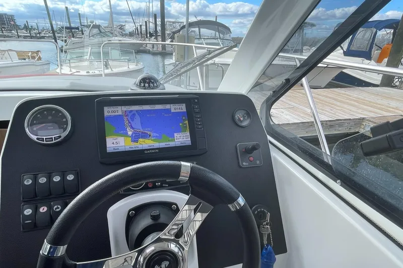 Slide: The Image of Cockpit view of 2020 Beneteau Antares 23 with Garmin navigation system. - 8