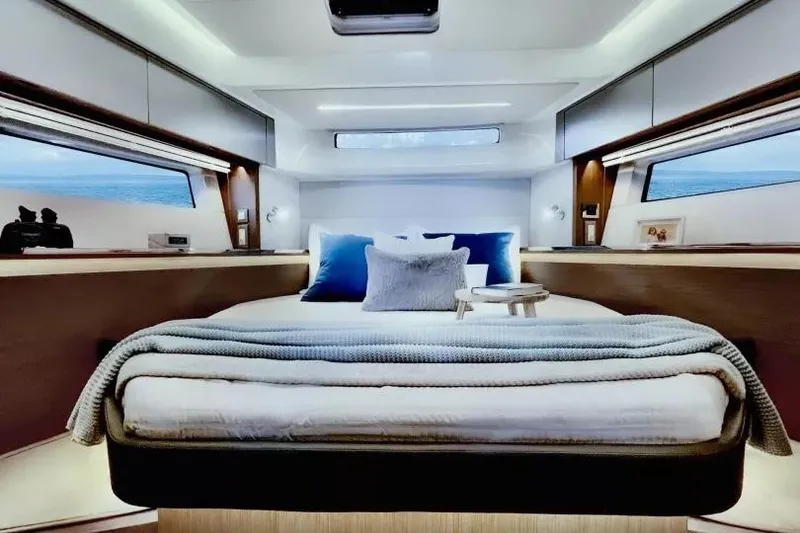 Slide: The Image of Luxurious bedroom interior of 2026 Beneteau Antares 12 yacht with ocean view windows. - 6