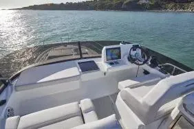 Slide: The Image of 2026 Beneteau Antares 12 yacht cockpit with modern navigation equipment on calm waters. - 8