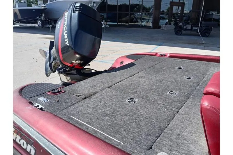 Slide: The Image of 2001 Triton TR19 boat with Mercury outboard motor, red and gray deck. - 10