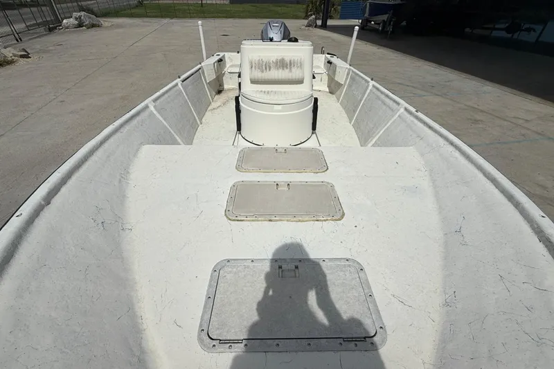 Slide: The Image of 1998 Hydra-Sports 22 Ocean CC boat interior with white seating and console. - 10