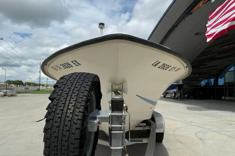 Slide: The Image of 1998 Hydra-Sports 22 Ocean CC boat on trailer, parked outdoors under cloudy sky. - 3