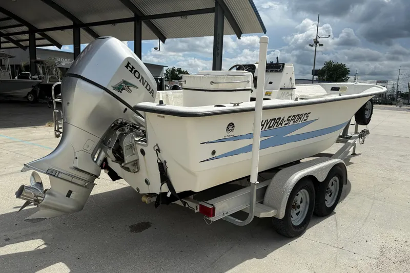 Slide: The Image of 1998 Hydra-Sports 22 Ocean CC boat interior with steering console and seating. - 7