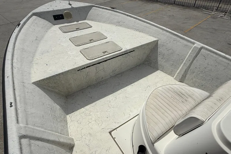 Slide: The Image of 1998 Hydra-Sports 22 Ocean CC boat interior with storage compartments and seating. - 9