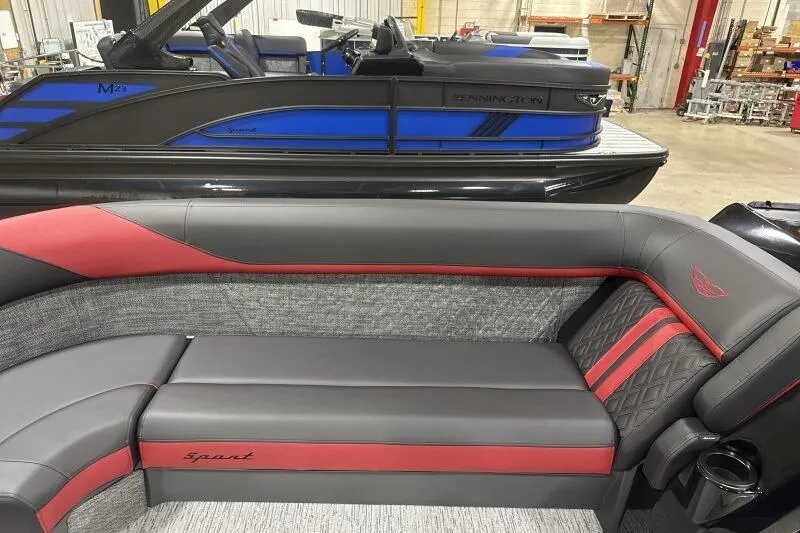 Slide: The Image of 2026 Bennington 24 MFBSF pontoon boat with luxurious seating and sleek design. - 17