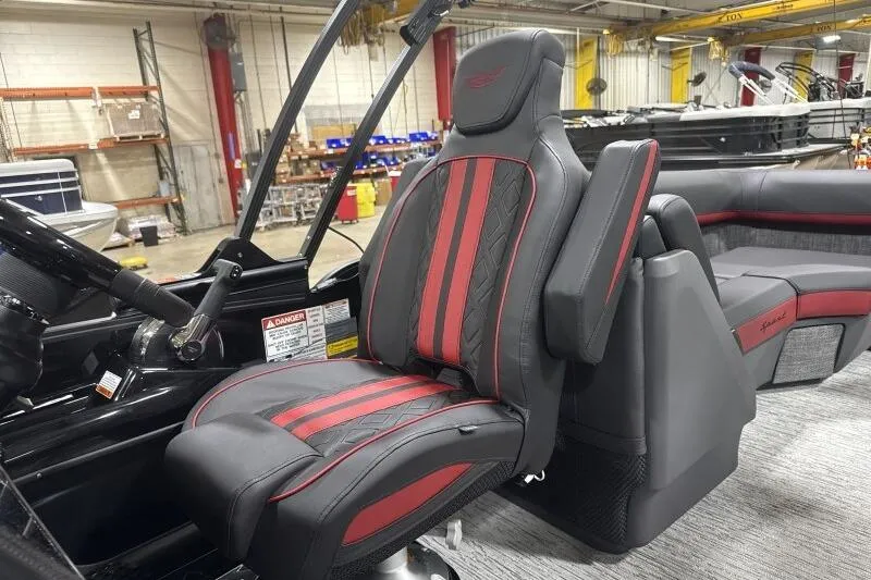 Slide: The Image of 2026 Bennington 24 MFBSF boat interior with red and black captain's chair. - 22