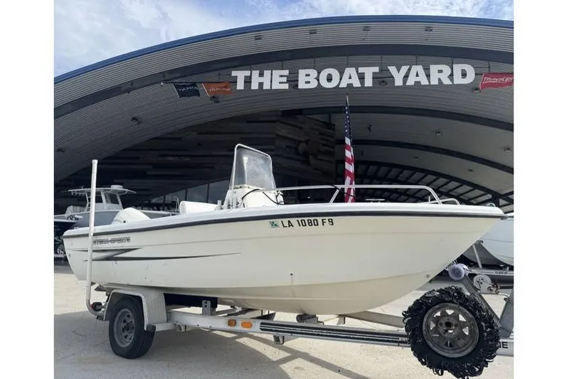 Slide: The Image of 2000 Hydra-Sports 18cc boat on trailer under cloudy sky. - 2