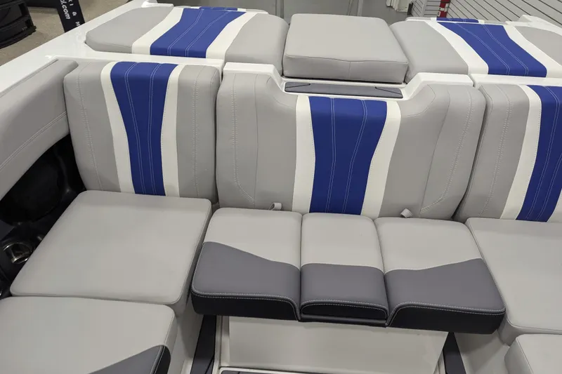Slide: The Image of 2026 Malibu Wakesetter 22 LSV interior with gray and blue seating. - 13