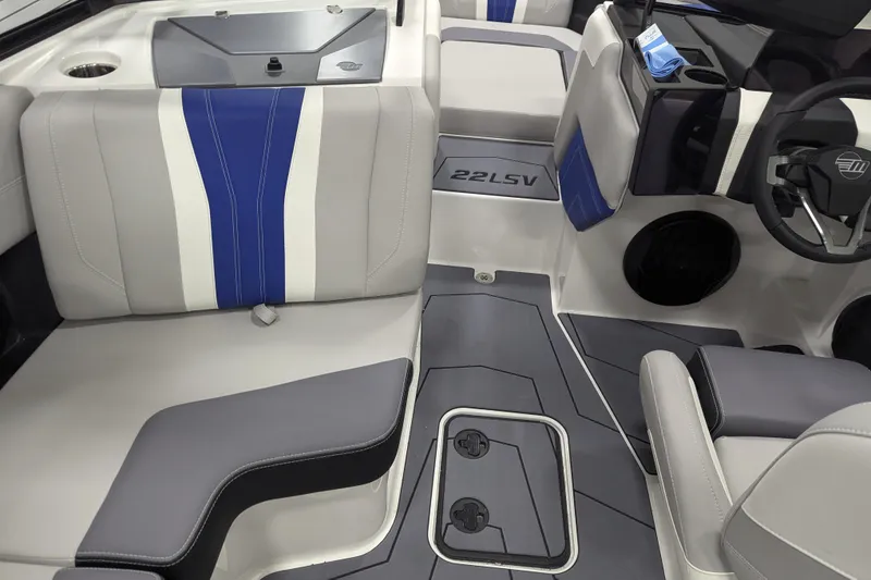 Slide: The Image of 2026 Malibu Wakesetter 22 LSV interior with blue and gray seating, modern design. - 16