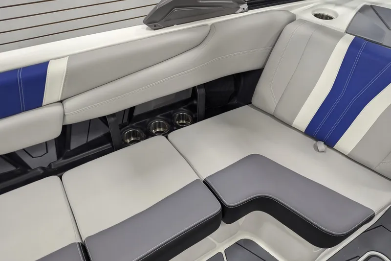 Slide: The Image of 2026 Malibu Wakesetter 22 LSV interior seating with blue and gray upholstery. - 17