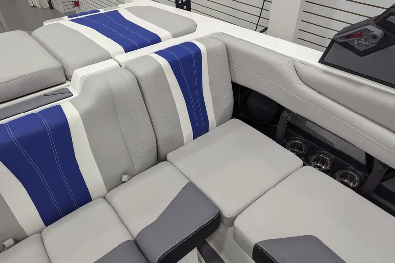 Slide: The Image of 2026 Malibu Wakesetter 22 LSV interior with gray and blue seating, modern design. - 19