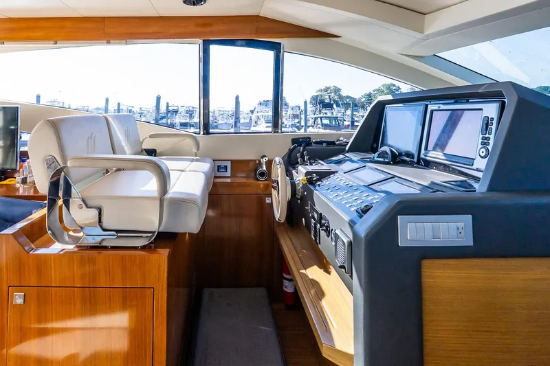 Slide: The Image of Luxurious helm of 2011 Uniesse 55S yacht with modern navigation equipment. - 23
