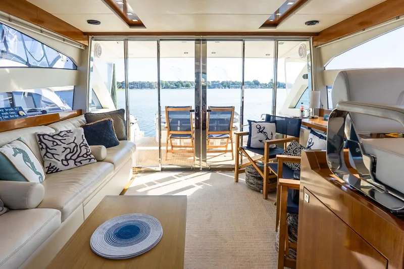 Slide: The Image of Luxurious interior of 2011 Uniesse 55S yacht with elegant seating and scenic water view. - 15