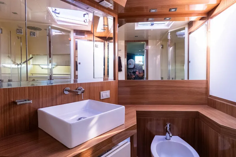 Slide: The Image of Luxurious bathroom interior of 2011 Uniesse 55S yacht with modern fixtures and wood accents. - 32
