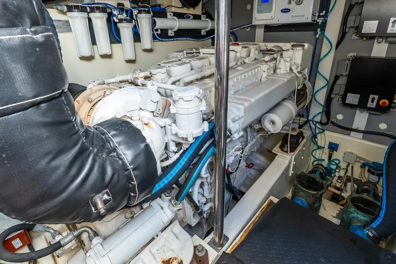 Slide: The Image of Engine room of 2011 Uniesse 55S yacht, showcasing mechanical components and systems. - 39
