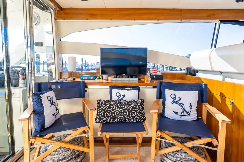 Slide: The Image of Luxurious 2011 Uniesse 55S yacht interior with nautical-themed decor and comfortable seating. - 18
