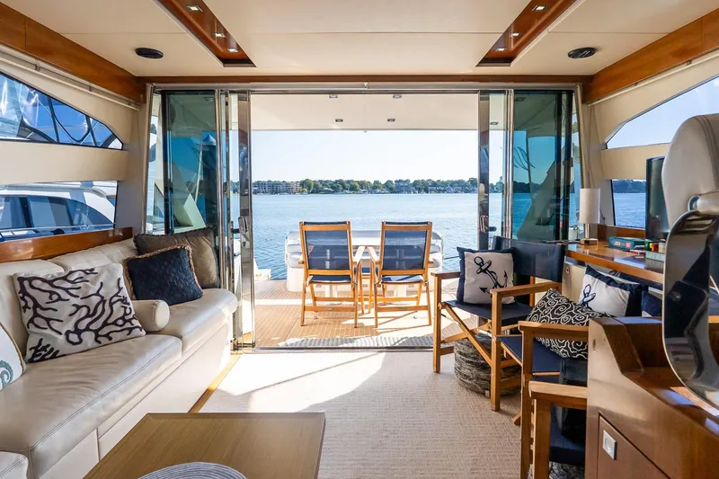 Slide: The Image of Luxurious interior of 2011 Uniesse 55S yacht with lake view and elegant seating. - 14