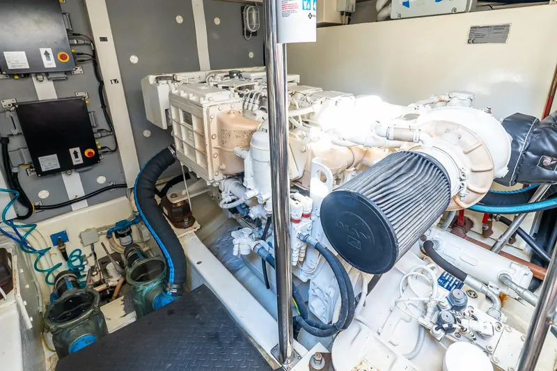 Slide: The Image of Engine room of 2011 Uniesse 55S yacht, showcasing mechanical components and systems. - 40