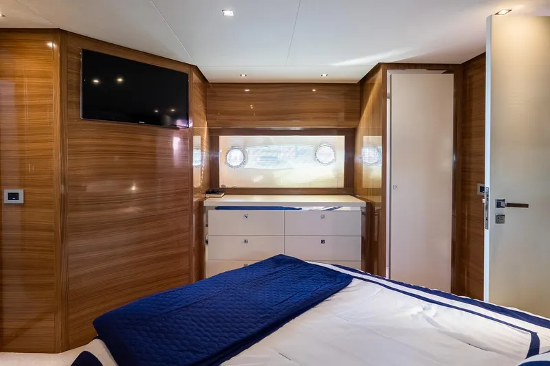Slide: The Image of Luxurious cabin interior of 2011 Uniesse 55S yacht with wood paneling and modern amenities. - 30
