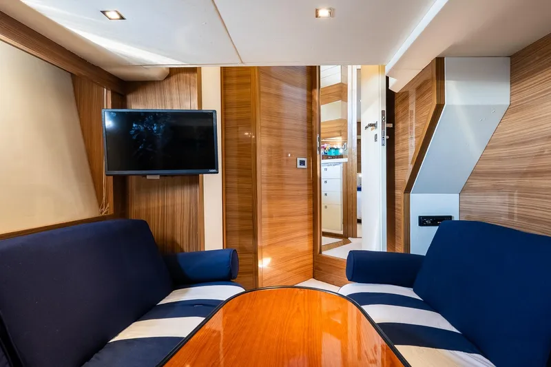 Slide: The Image of Luxurious interior of 2011 Uniesse 55S yacht with modern seating and TV. - 26