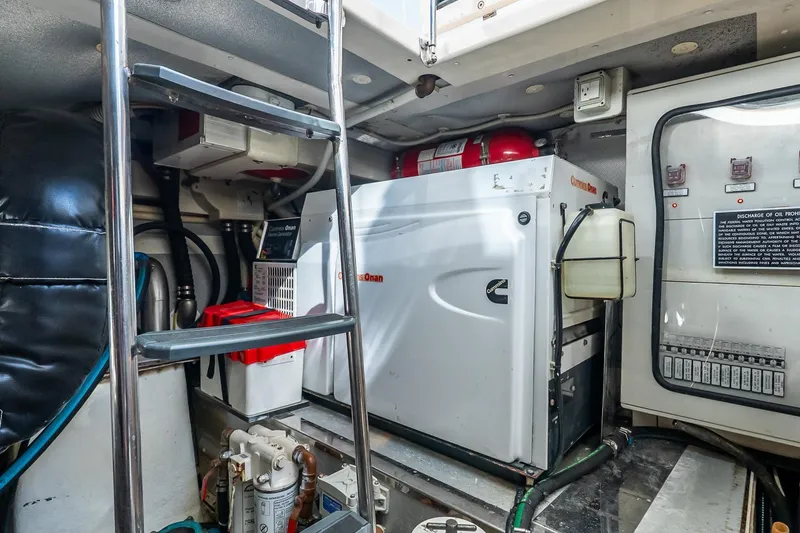 Slide: The Image of Engine room of 2011 Uniesse 55S yacht with Cummins Onan generator and control panel. - 38