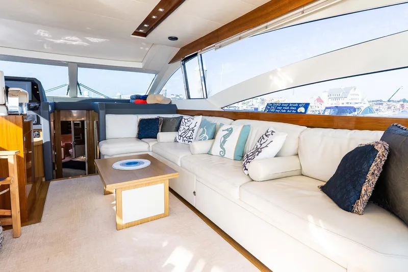 Slide: The Image of Luxurious interior of 2011 Uniesse 55S yacht with elegant white seating and decorative pillows. - 20
