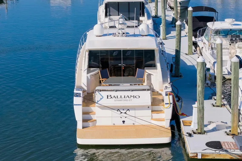 Slide: The Image of 2011 Uniesse 55S yacht docked at marina, rear view. - 3