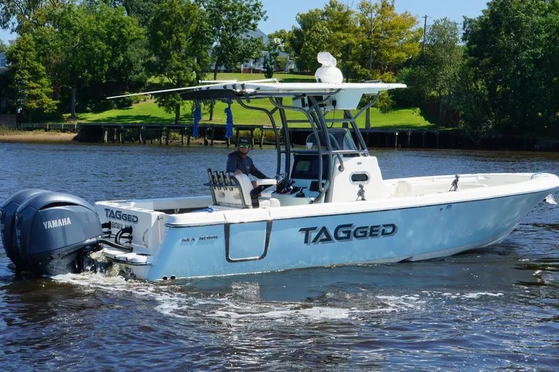 The Image of 2023 Sea Born LX26 Center Console boat cruising on a river with Yamaha engines. - 1