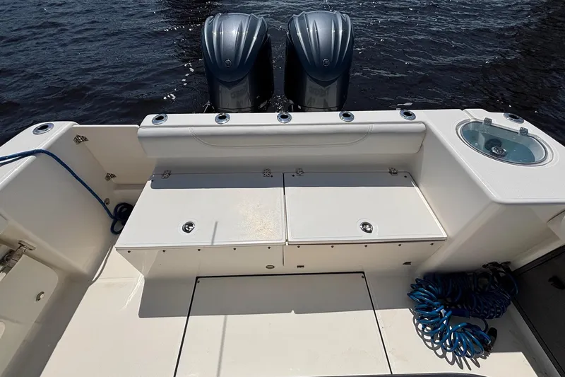 Slide: The Image of 2023 Sea Born LX26 Center Console boat with dual engines and spacious deck. - 12