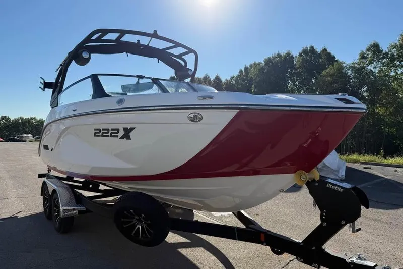 Slide: The Image of 2026 Yamaha Boats 222XD on trailer, sleek design, red and white color scheme. - 2