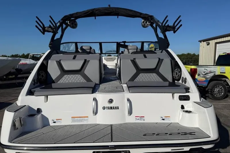 Slide: The Image of 2026 Yamaha Boats 222XD, rear view, showcasing seating and sleek design. - 5