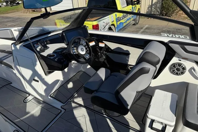Slide: The Image of Interior of 2026 Yamaha Boats 222XD, featuring modern dashboard and comfortable seating. - 7