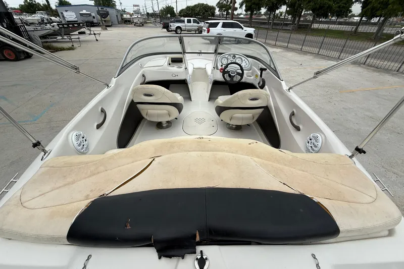 Slide: The Image of Interior of a 2010 Tahoe Q4 boat with seating and steering wheel. - 8