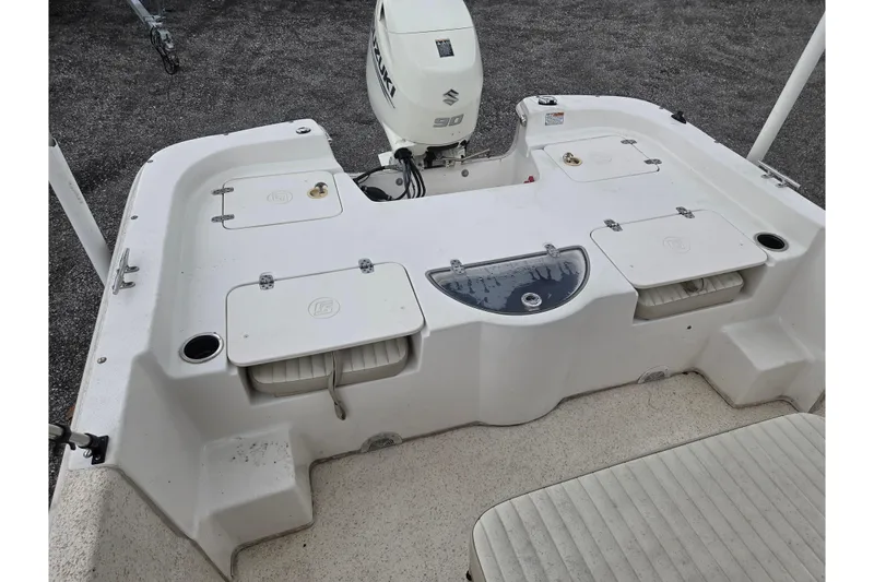 Slide: The Image of 2019 Carolina Skiff 198 DLV boat deck with Suzuki 90 outboard motor. - 6