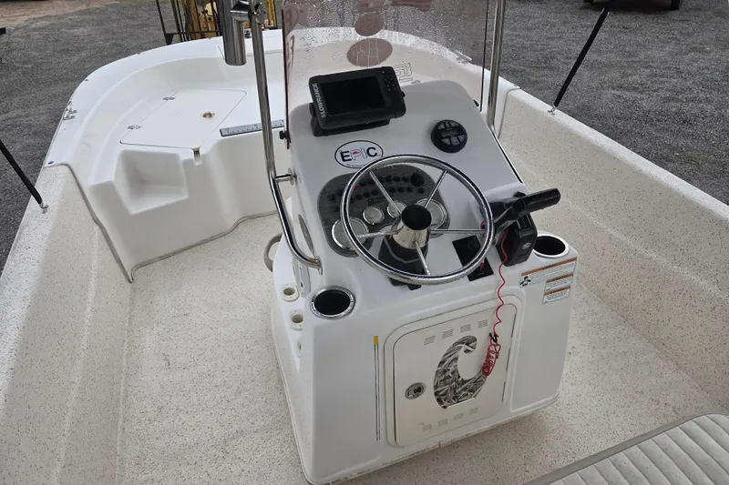 Slide: The Image of 2019 Carolina Skiff 198 DLV boat console with steering wheel and controls. - 9