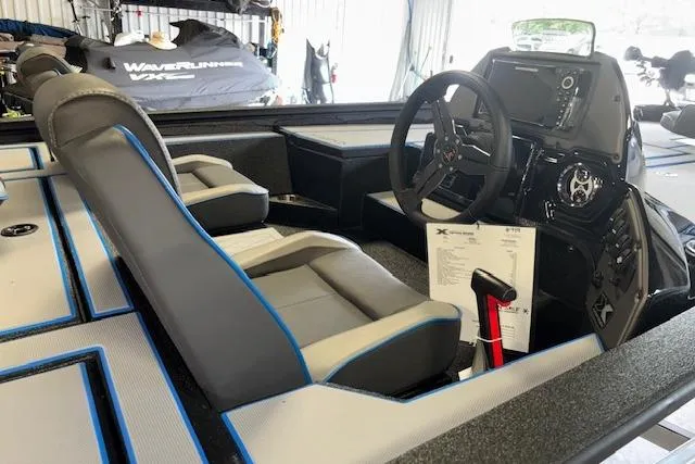 Slide: The Image of 2026 Xpress H20 Bass boat interior with modern seating and control panel. - 13