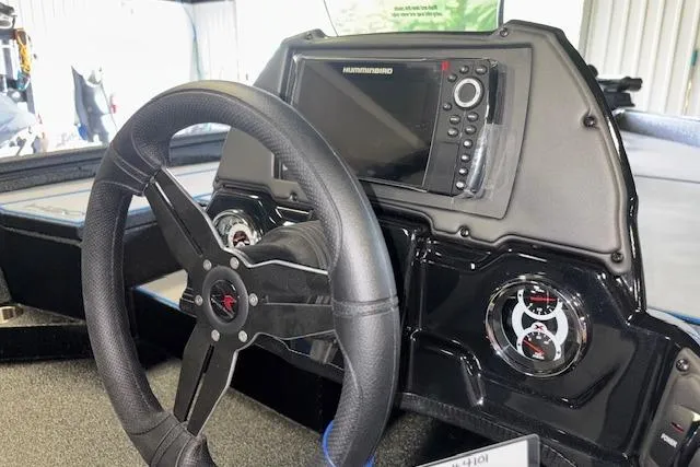 Slide: The Image of Steering wheel and dashboard of 2026 Xpress H20 Bass boat with navigation system. - 15